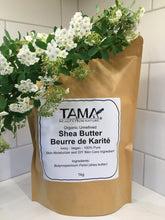 Shea butter from Ghana in a paper pouch, with flowers in foreground